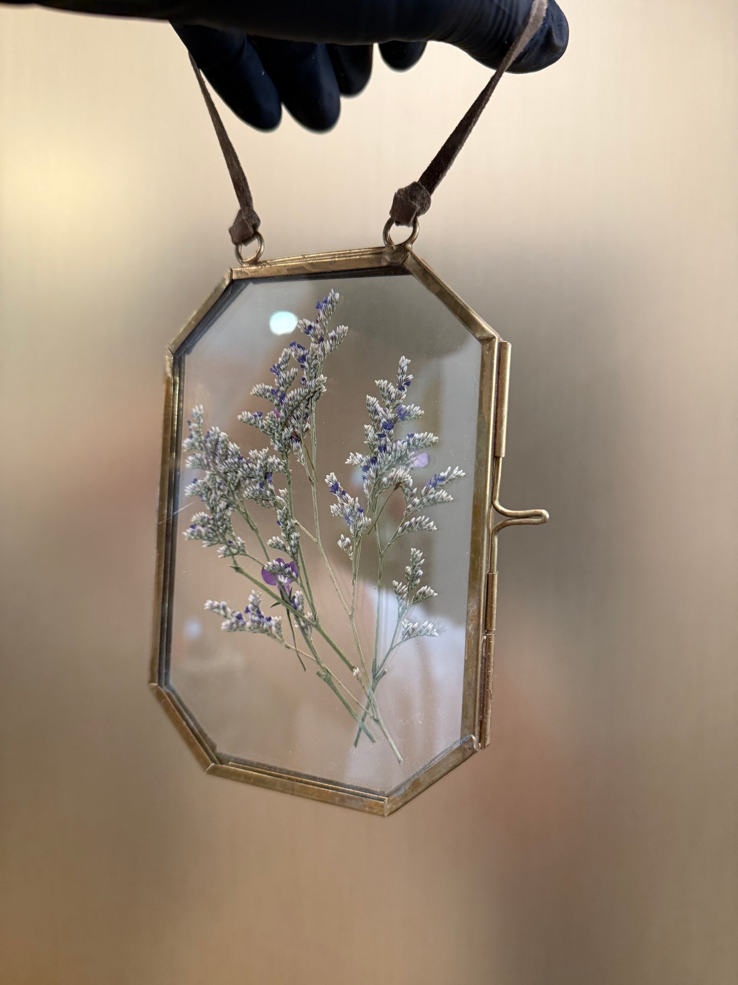 Pressed flowers in hanging glass