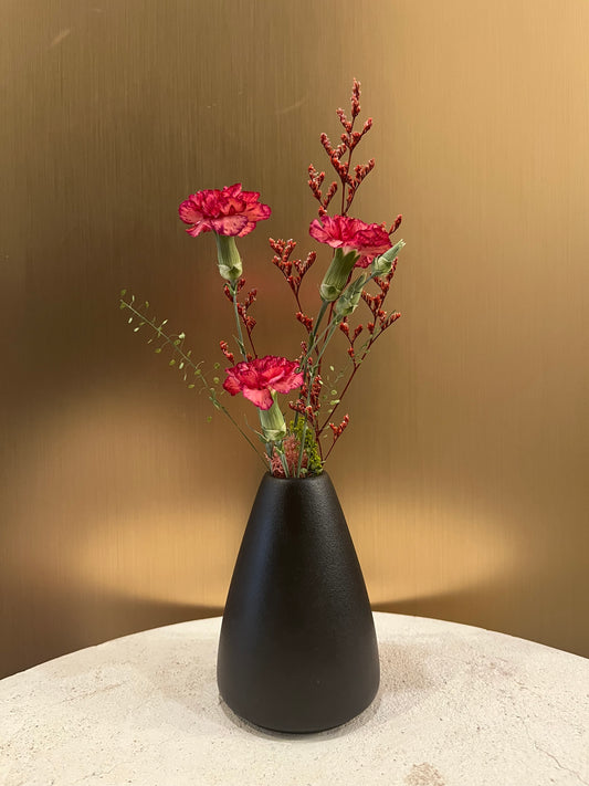 Preserved carnation in a vase