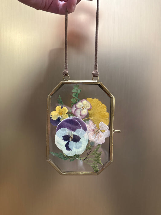 Pressed flowers in hanging glass