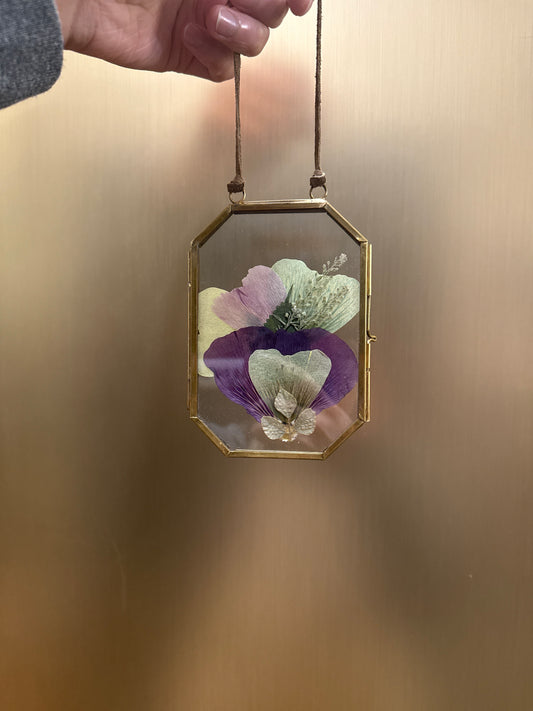 Pressed flowers in hanging glass
