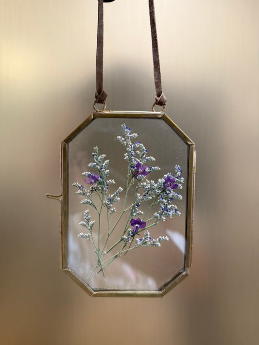 Pressed flowers in hanging glass